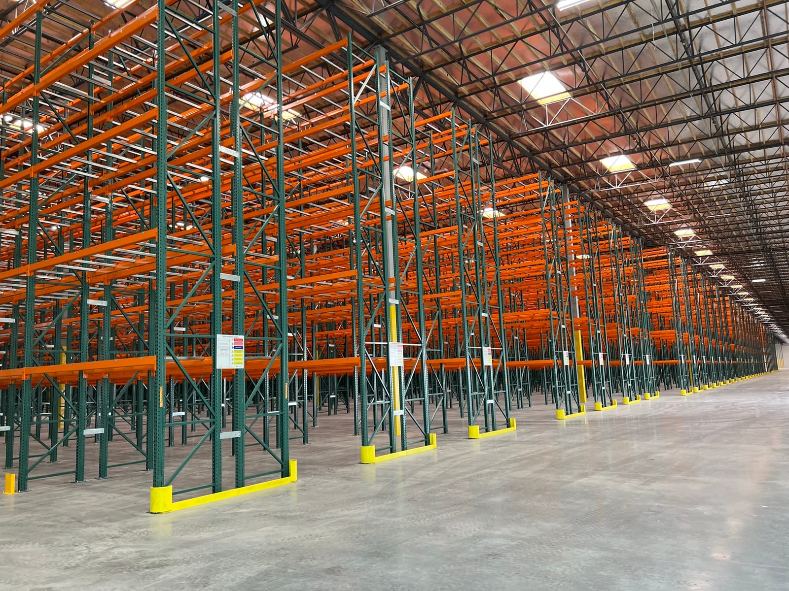 Long rows of very narrow aisle pallet racking six levels high across a 500,000 sq ft document storage building in Victorville, CA